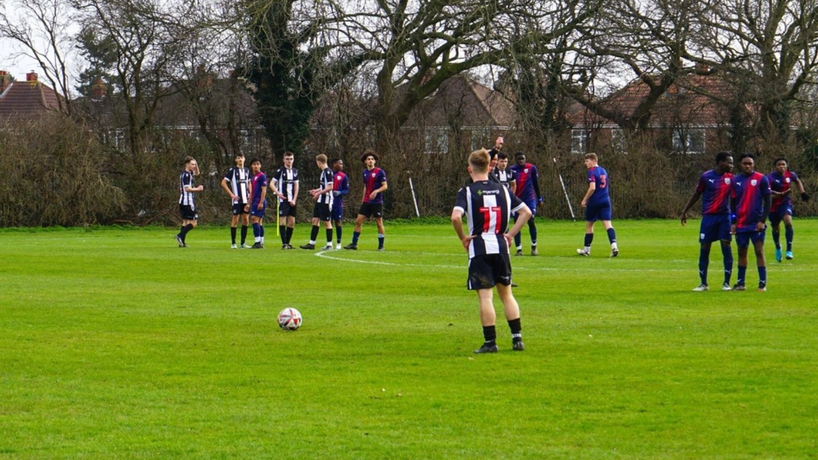 A group of soccer players on a field during the GTFSS 2-1 West Brom report.